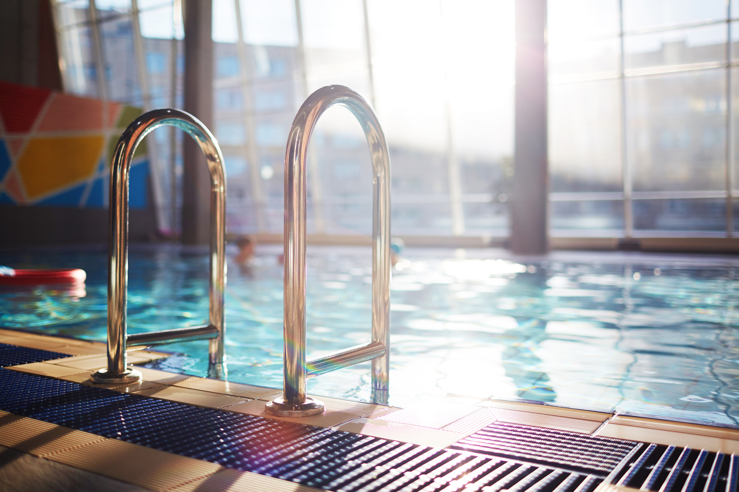 Floor, railings and swimming-pool inside modern sports center